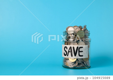 Coins in glass jar, Financial business investment, Growing money, People saving money, Money for future, Money saving concept Coins in glass jar, Financial business investment, Growing money, People saving money, Money for future, Money saving concept 104915089