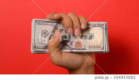 Hundred dollar bills on red background, Banknotes for money saving, Cash money dollars, Business investment and income, Global financial crisis, Earning and saving money concept Hundred dollar bills on red background, Banknotes for money saving, Cash money dollars, Business investment and income, Global financial crisis, Earning and saving money concept 104915092