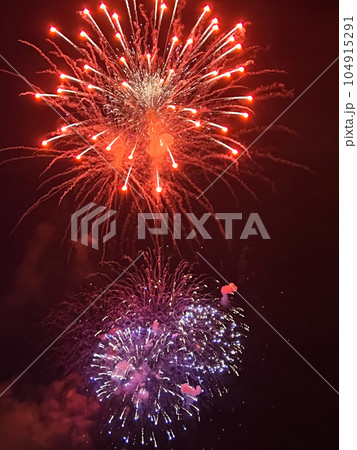 Night festive beautiful fireworks from different colors Night festive beautiful fireworks from different colors 104915291