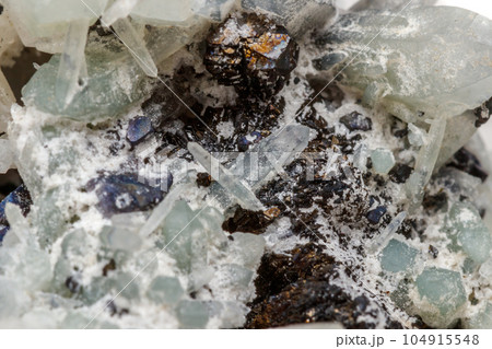 Macro mineral stone Drusus quartz with sphalerite in the rock a white background 104915548