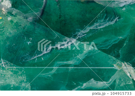 Macro mineral stone Fluorite crystal on a black background Macro mineral stone Fluorite crystal on a black background 104915733