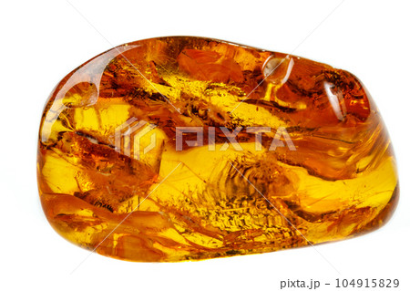 Macro Amber mineral stone with spider on white background Macro Amber mineral stone with spider on white background 104915829
