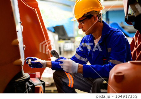 Portrait of expertise technician working at industrial plant 104917355