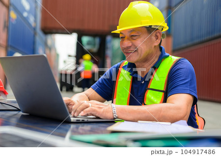 Warehouse engineer worker checking and working at industrial container station 104917486
