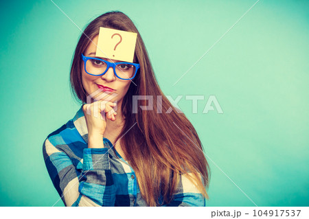 Thinking woman with big eyeglasses and light bulb Thinking woman with big eyeglasses and light bulb 104917537