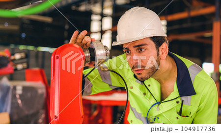 Technician engineer checking and repairing automatic robotic machine Technician engineer checking and repairing automatic robotic machine 104917736