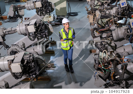 Female business owner engineer managing and checking work at factory 104917928