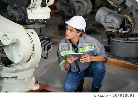 Maintenance engineer worker working with robotic machine automation 104918091