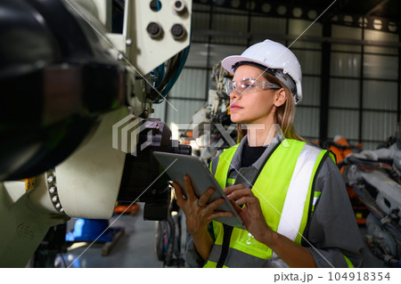 Maintenance engineer worker working with robotic machine automation 104918354