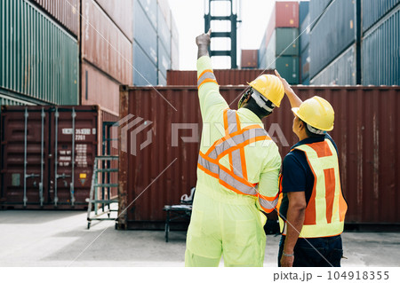 Warehouse engineer worker working at industrial container yard 104918355