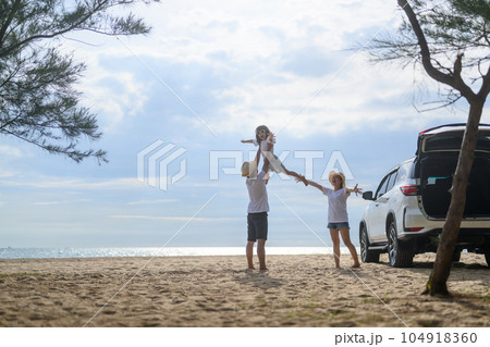 Happy Asian family travel on beach on holiday 104918360