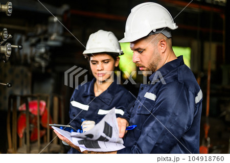 Professional mechanical engineer team checking and repairing engine machine 104918760