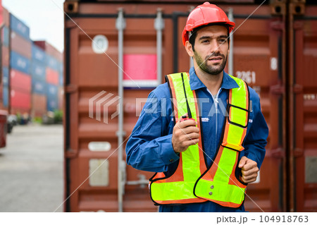Warehouse engineer worker checking and working at industrial container station Warehouse engineer worker checking and working at industrial container station 104918763