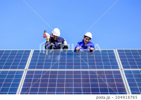 Solar panel station, Engineer installing solar panel at solar energy farm field Solar panel station, Engineer installing solar panel at solar energy farm field 104918765