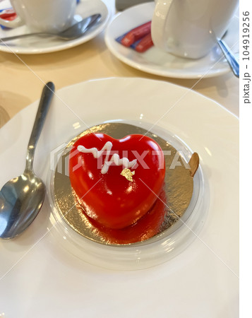 Cake heart with edible gold on the table Cake heart with edible gold on the table 104919256