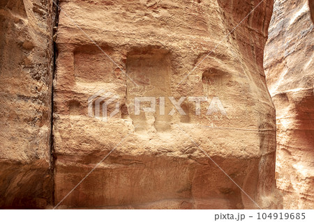 View of a wall with a man-made sandstone window. Petra, Jordan View of a wall with a man-made sandstone window. Petra, Jordan 104919685