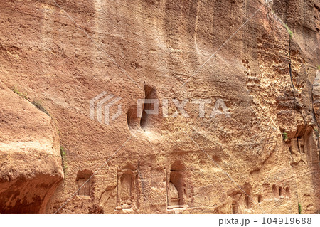 View of a wall with a man-made sandstone window. Petra, Jordan View of a wall with a man-made sandstone window. Petra, Jordan 104919688