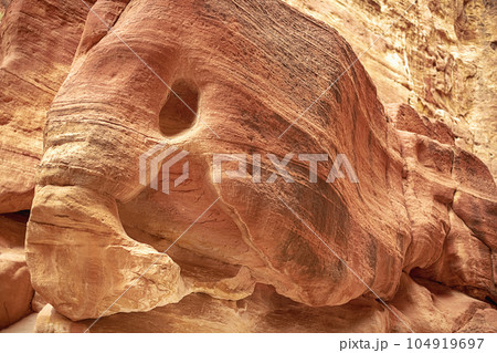 View of a wall with a man-made sandstone window. Petra, Jordan 104919697