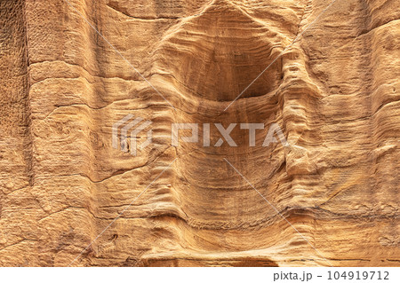 View of a wall with a man-made sandstone window. Petra, Jordan View of a wall with a man-made sandstone window. Petra, Jordan 104919712