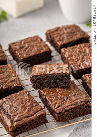 Homemade fudgy brownies on a baking rack 104921817