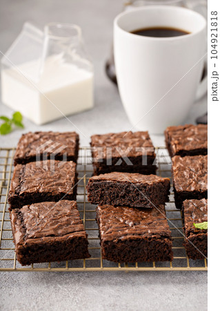 Homemade fudgy brownies on a baking rack 104921818