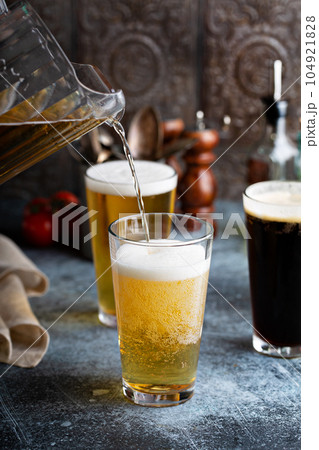 Assortment of beer in tall glasses 104921828