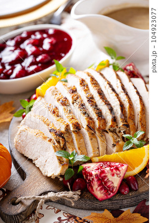 Sliced turkey on Thanksgiving or Christmas table Sliced turkey on Thanksgiving or Christmas table 104923077