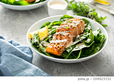 Cedar plank roasted salmon with spinach Cedar plank roasted salmon with spinach 104923152