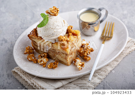 Caramel apple bread pudding with ice cream Caramel apple bread pudding with ice cream 104923433