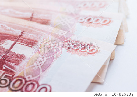 Five thousand ruble notes stacked, closeup Five thousand ruble notes stacked, closeup 104925238