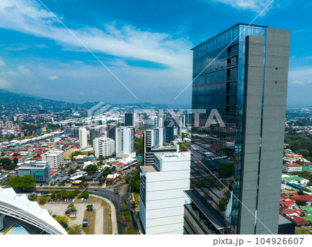 Beautiful aerial view of the Sabana, San Jose, Costa Rica. San Jose Costa rica capital city street view with mountains in the background. Beautiful aerial view of the Sabana, San Jose, Costa Rica. San Jose Costa rica capital city street view with mountains in the background. 104926607