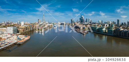 Aerial view of the Tower Bridge in London. One of London's most famous bridges and must-see landmarks in London. Beautiful panorama of London Tower Bridge. Aerial view of the Tower Bridge in London. One of London's most famous bridges and must-see landmarks in London. Beautiful panorama of London Tower Bridge. 104926638