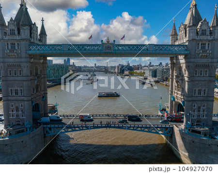 Aerial view of the Tower Bridge in London. One of London's most famous bridges and must-see landmarks in London. Beautiful panorama of London Tower Bridge. Aerial view of the Tower Bridge in London. One of London's most famous bridges and must-see landmarks in London. Beautiful panorama of London Tower Bridge. 104927070