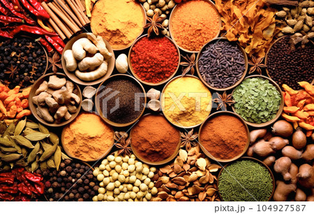 Spices and herbs in wooden bowls. Food and cuisine ingredients 104927587