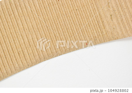 closeup brown paper cardboard texture on white background closeup brown paper cardboard texture on white background 104928802