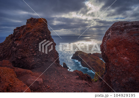 Volcanic sea cliffs of the Sao Lourenco peninsula, eastern Madeira, Portugal, Atlantic Ocean 104929195