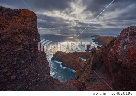 Volcanic sea cliffs of the Sao Lourenco peninsula, eastern Madeira, Portugal, Atlantic Ocean 104929196