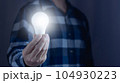 Man hand holding light bulb. idea concept with innovation and inspiration 104930223