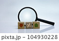 Financial concept to analysing business progress with magnifying glass on background. 104930228