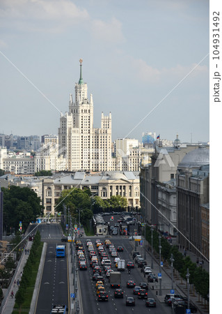 Vertical shot of the main street and one of the Seven Sisters skyscrapers in Moscow, Russia 104931492