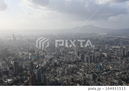 Aerial view of a beautiful city from the roof of Taipei 101 on a cloudy day in Taiwan Aerial view of a beautiful city from the roof of Taipei 101 on a cloudy day in Taiwan 104931515