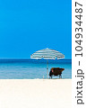 Beach chairs on the white sand beach 104934487