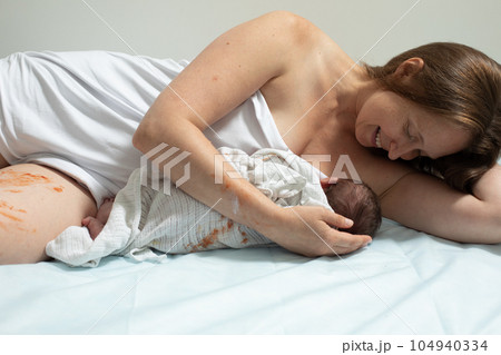 Woman with new born baby have a rest Woman with new born baby have a rest 104940334