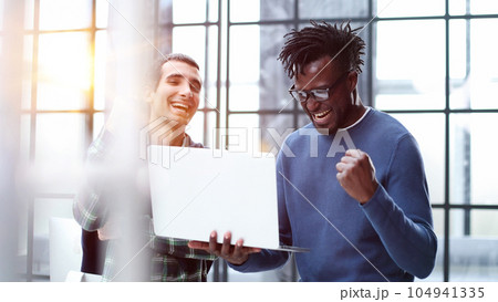 Business people talking near glass wall in office 104941335