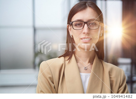 Portrait of a young beautiful business woman in the office Portrait of a young beautiful business woman in the office 104941482