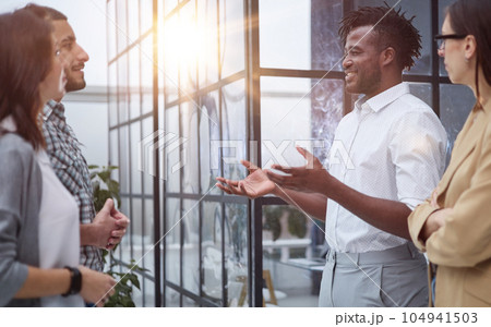 Motivated international multi-ethnic company members corporate team Motivated international multi-ethnic company members corporate team 104941503