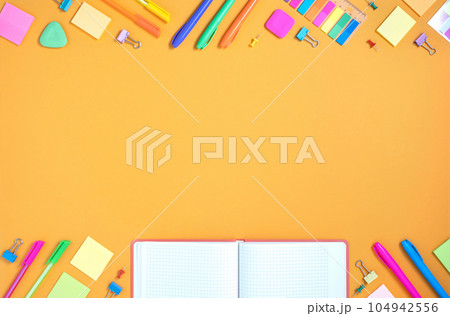 Frame of colorful school and office stationery set on yellow background. Flatly. 104942556
