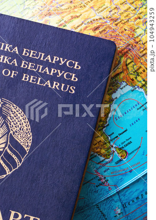 Belarusian passport on the map background closeup 104943259