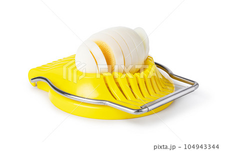 Boiled egg in the egg slicer. 104943344