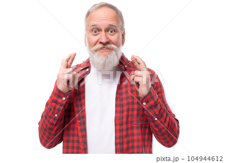 joyful lucky 60s retired man with white beard and mustache in red shirt joyful lucky 60s retired man with white beard and mustache in red shirt 104944612